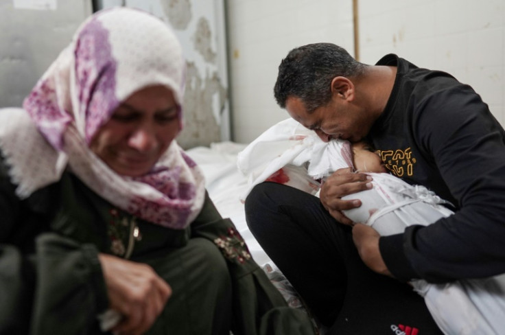 Palestinians mourn family members killed in Israeli bombardment on the Nuseirat refugee camp