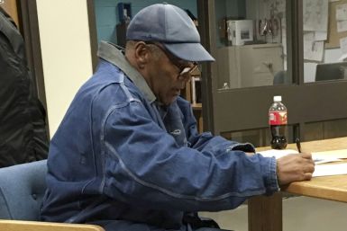 This image released by the Nevada Department of Corrections shows O.J. Simpson signing documents and leaving prison in Nevada in October 2017