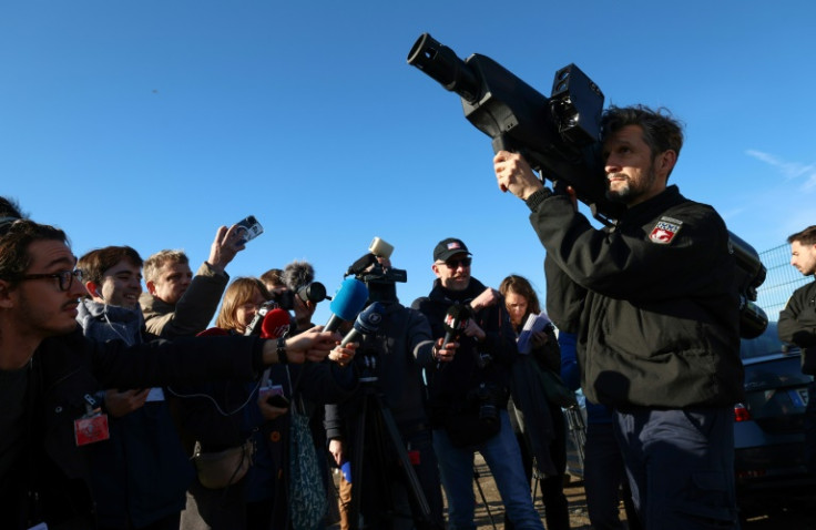 A French policeman demonstrates an anti-drone gun at a military base in Velizy-Villacoublay, southwest of Paris