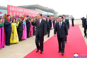 China's top lawmaker Zhao Leji (centre L) walks with Choe Ryong Hae (R), chairman of North Korea's Standing Committee of the Supreme People's Assembly on April 11