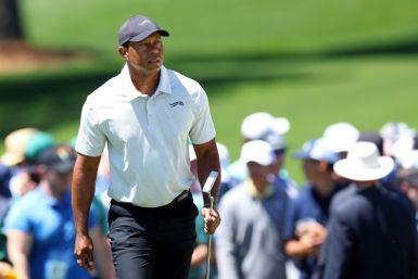 Tiger Woods, a 15-time major winner, walks to the second green during the third round of the 88th Masters