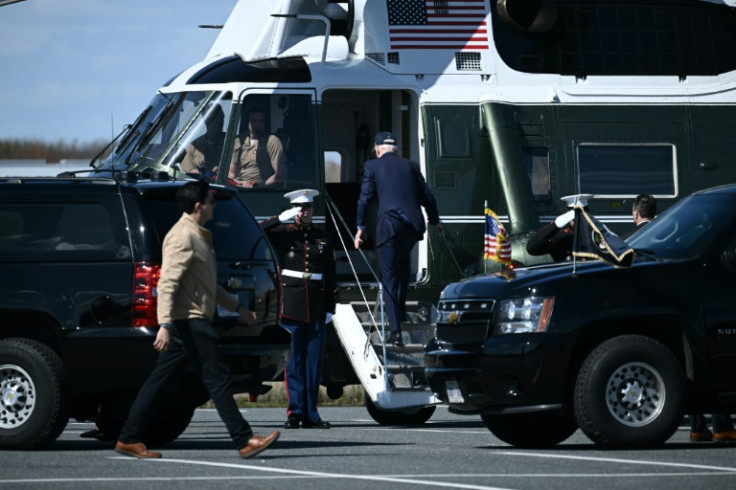 US President Joe Biden boards Marine One at Gordons Pond in Rehoboth Beach, Delaware, as he returns to the White House on April 13, 2024