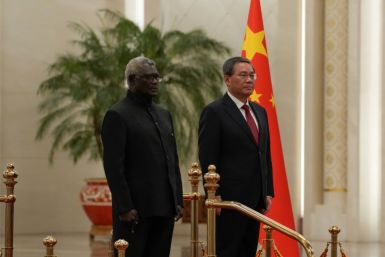 Solomon Islands' Prime Minister Manasseh Sogavare (L) has brought the country closer to China