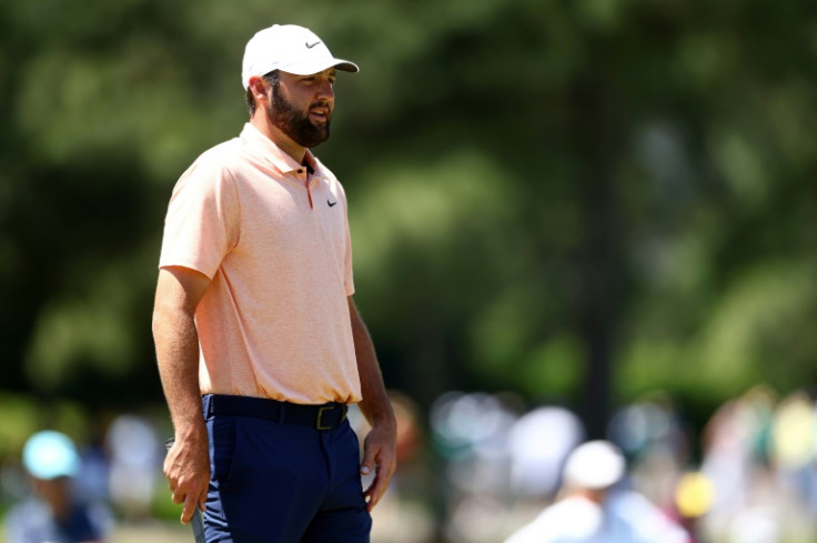 Top-ranked Scottie Scheffler warms up on the practice range ahead of his start in the last group of Sunday's final round of the Masters