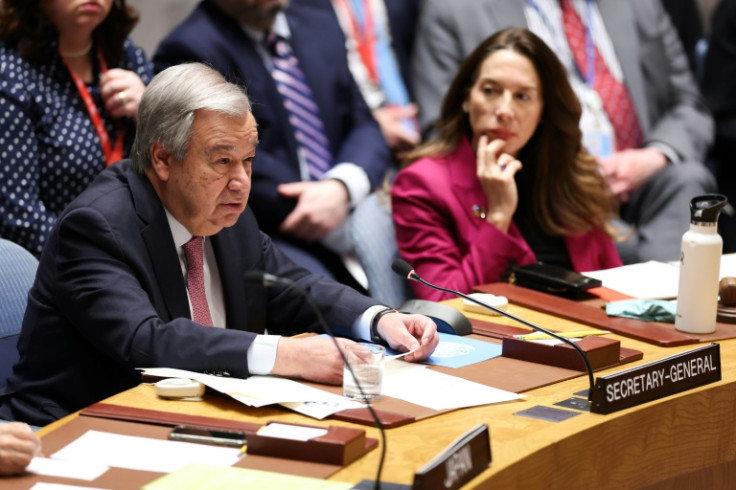 United Nations Secretary-General Antonio Guterres (L) delivers opening remarks during a UN Security Council meeting on the situation in the Middle East, including Iran's recent attack against Israel, on April 14, 2024