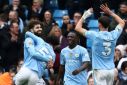 Manchester City beat Luton 5-1 to go two points clear at the top of the Premier League