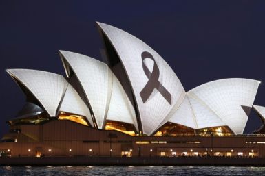 A black ribbon is projected onto the Sydney Opera House  as a mark of respect for the six victims killed in a stabbing rampage in a suburban shopping mall on Saturday