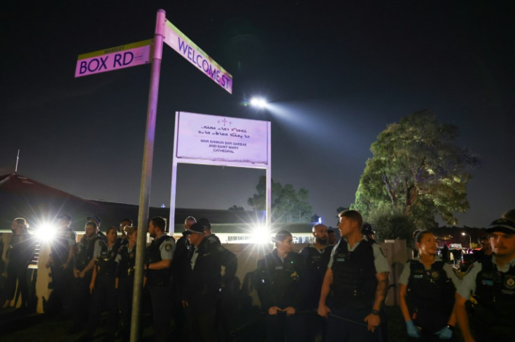 New South Wales police guard the perimeter of the Christ the Good Shepherd Church in Sydney's western suburb of Wakeley on April 15, 2024, after several people were stabbed in the church premises.  Australian police arrested a man after several people wer