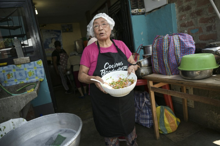 Isabel Santos with a salad made of carrot peels and pea shells, food scraps ' that we used to throw away'