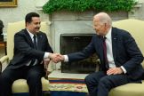 US President Joe Biden (R) shakes hands with the Prime Minister of Iraq Mohammed Shia al-Sudani in the Oval Office of the White House in Washington, DC on April 15, 2024. Sudani's trip to Washington, his first since taking office in October 2022, was or