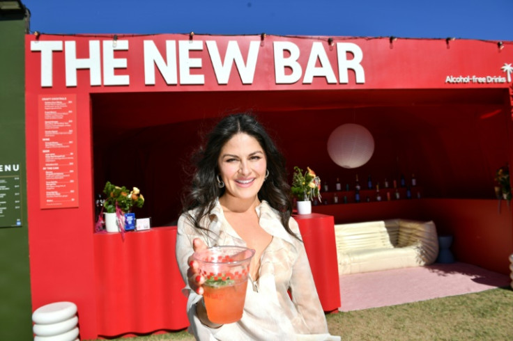 Brianda Gonzalez, founder and CEO of The New Bar, in front of their stand proffering non-alcoholic drinks at Coachella