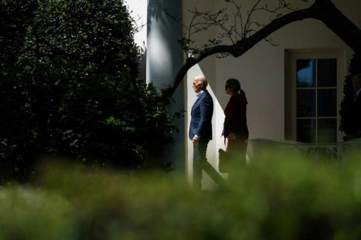 US President Joe Biden and Deputy Chief of Staff Annie Tomasini depart the Oval Office and walk to Marine One on the South Lawn of the White House in Washington, DC, on April 16, 2024.  Biden is travelling to Scranton, Pennsylvania.