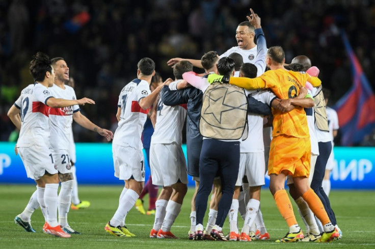 Kylian Mbappe and his teammates celebrate after Paris Saint-Germain beat Barcelona to reach the Champions League semi-finals