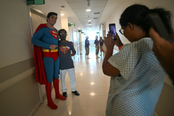 Leonardo Muylaert, as Superman, visits patients at the National Institute of Traumatology and Orthopedics (INTO) in Rio de Janeiro