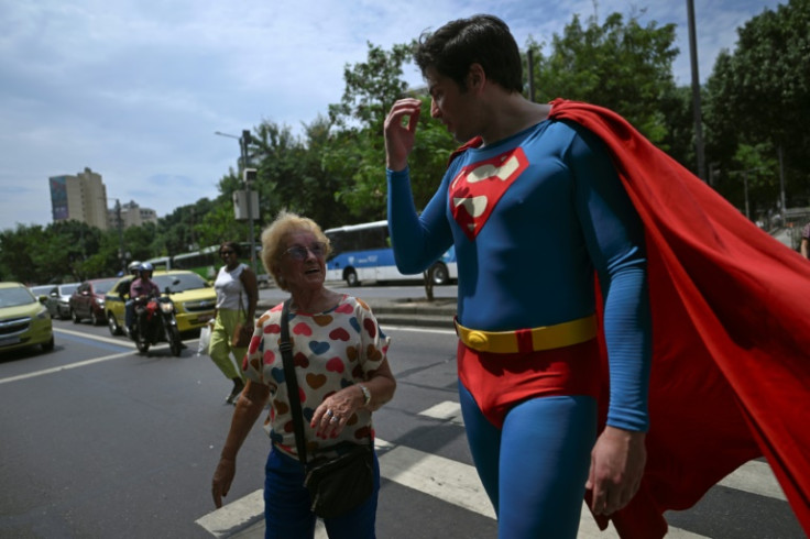 True superhero: Muylaert helps an elderly woman cross the street