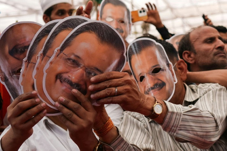 Supporters of hold masks of jailed Delhi Chief Minister Arvind Kejriwal, leader of the Aam Aadmi Party (AAP), or Common Man's Party