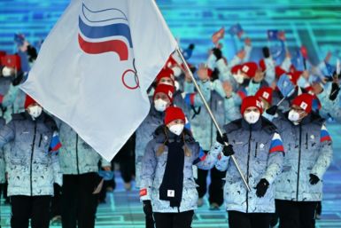 Russia's flag bearers Olga Fatkulina and Vadim Shipachev lead the delegation during the opening ceremony of the Beijing 2022 Winter Olympic Games, at the National Stadium, known as the Bird's Nest, in Beijing, on February 4, 2022.