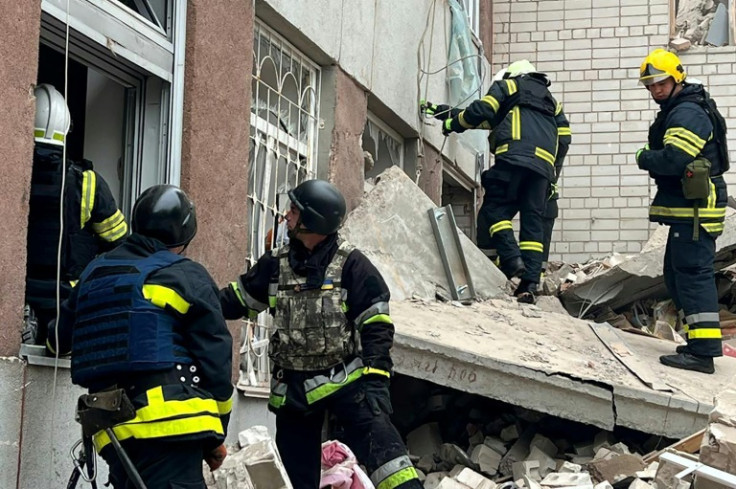 Three Russian missiles hit the Ukrainian city of Chernigiv on Wednesday, according to the Ukrainian Emergency Service which released this image of rescue work