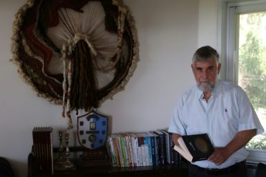 Ben-David is pictured among his books at home