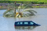 Cars are stranded on a flooded in Dubai following heavy rains on April 18, 2024