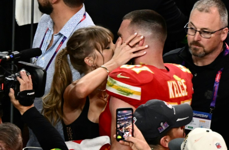 Taylor Swift kisses Kansas City Chiefs tight end Travis Kelce after the Chiefs won Super Bowl LVIII against the San Francisco 49ers