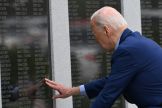US President Joe Biden pays respects to his uncle World War II veteran Ambrose J, Finnegan, Jr. at the Veterans War Memorial in Scranton, Pennsylvania, before departing for Pittsburgh, on April 17, 2024. Biden is traveling to Pittsburgh, Pennsylvania, to 