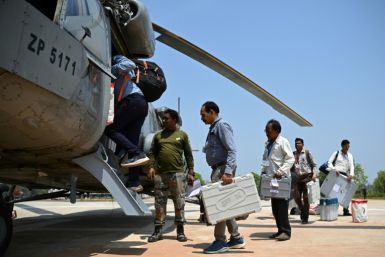 Voting in India, the world's most populous nation, is a major logistical exercise: here polling officials on army helicopters bring electronic voting machines to Chhattisgarh state