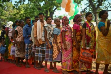 People queue to vote in a village in Bastar district, one of the last strongholds of the Naxal rebels