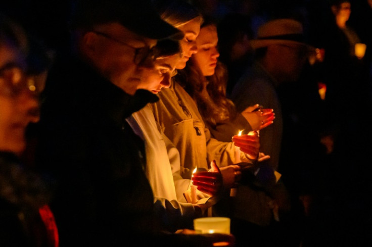 Many hundreds sat on the grass in a beachside park to grieve for the five women and a Pakistani male security guard who died in the April 13 attack