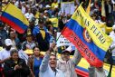 People take part in a march against the government of Colombian President Gustavo Petro over health and pension reforms in Bogota on April 21, 2024