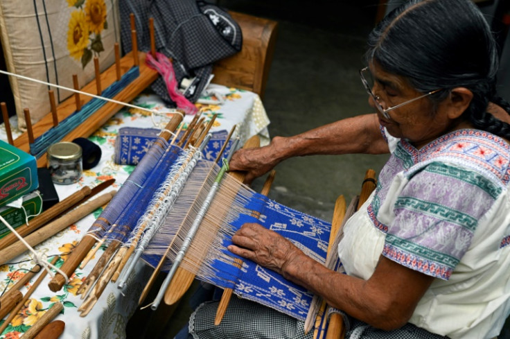 Martina Cruz, 83, weaves a traditional garment in the Mexican town of El Mejay in Hidalgo State