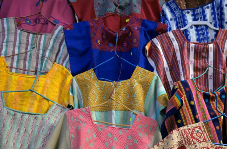 Traditional Indigenous blouses are seen for sale in a handicraft market in Mexico City