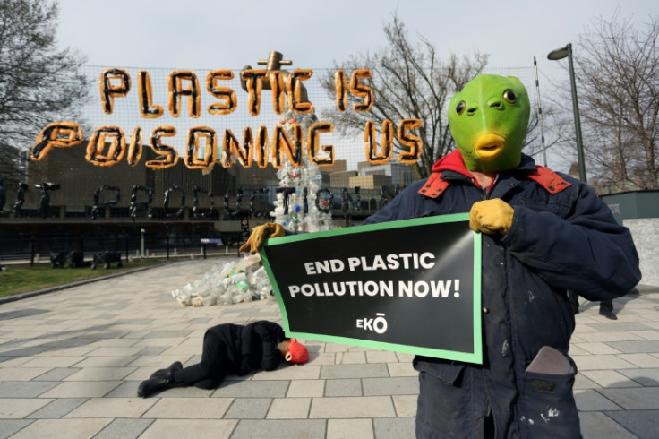 Activists stage a die-in at the start of the fourth session of the UN Intergovernmental Negotiating Committee on Plastic Pollution in Ottawa, Canada, on April 23, 2024