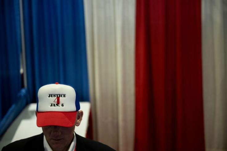 A man at a Republican event in Maryland on February 22, 2024, wears a cap to show support for people sentenced to jail for their roles in the January 6, 2021, occupation of the US Capitol