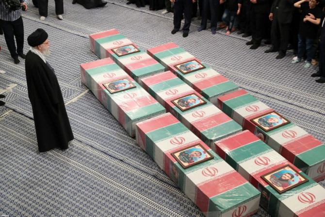 Iran's supreme leader Ayatollah Ali Khamenei leads prayers by the coffins of seven Revolutionary Guards killed in an April 1 air strike on the Iranian consulate in Damascus