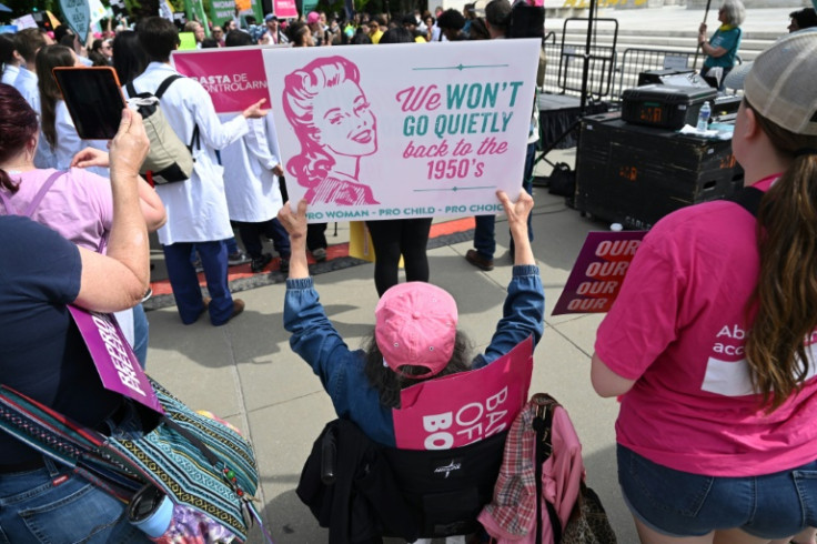 Emotions ran deep outside the courtroom where hundreds of women's rights activists, some draped in red-stained sheets, shouted "Abortion is health care!" Anti-abortion activists also arrived in large numbers and chanted slogans