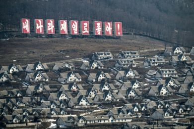 'My country is the best!' a sign above the North Korean town of Chunggang reads