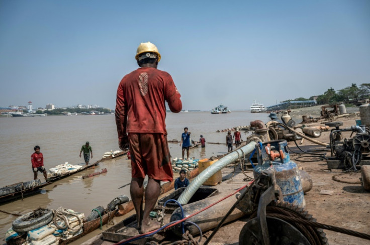 Once the wreck is out of the water, another team moves in to cut away the metal with blowtorches