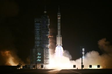 A Long March-2F carrier rocket, carrying the Shenzhou-18 spacecraft and a crew of three astronauts, lifts off from the Jiuquan Satellite Launch Center