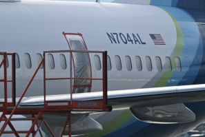 The missing emergency door of Alaska Airlines N704AL, which made an emergency landing at Portland International Airport is covered and taped, in Portland, Oregon on January 23, 2024