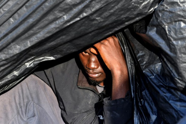 A migrant inside a makeshift shelter at a camp in El Amra north of Sfax