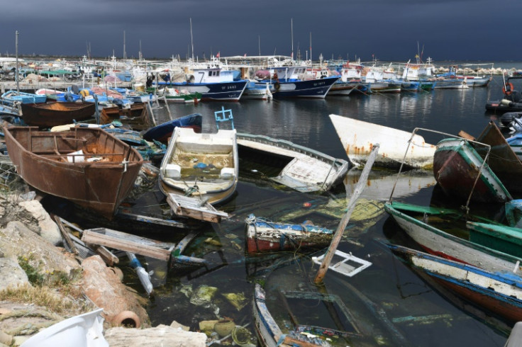 The remains of boats used by migrants at the Mediterranean port of El Amra