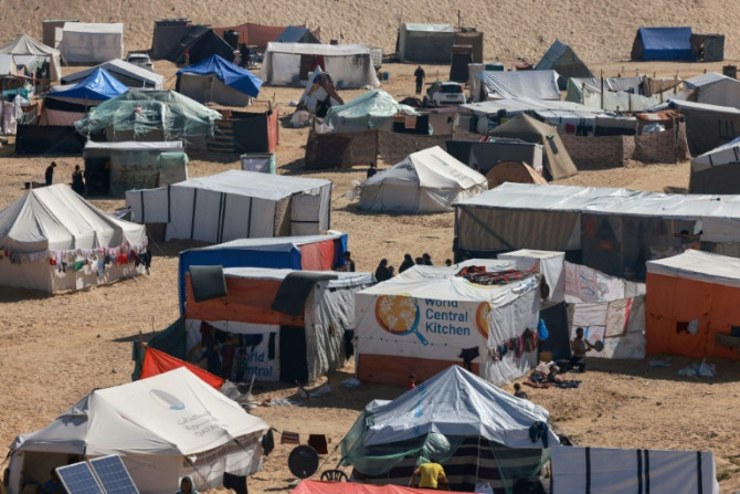 Palestinians' makeshift tents and a tent with the logo of World Central Kitchen in Rafah in the southern Gaza Strip on April 4, 2024
