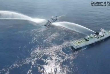 The Philippine Coast Guard says the China Coast Guard used water cannon against one of its vessels (C) and another from the fisheries bureau