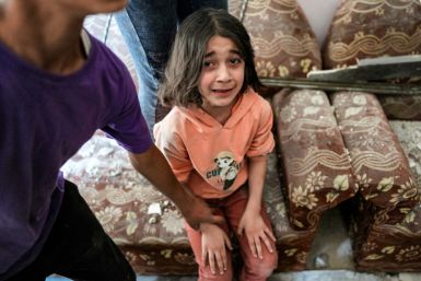A girl inside a Gaza building following Israeli bombardment in Nuseirat in the central Gaza Strip on April 29, 2024