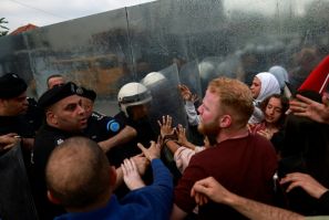 Palestinian Authority police prevent demonstrators from reaching the Canadian Representative Office in Ramallah in the occupied West Bank on April 30, 2024