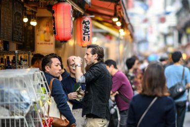 Many tourists are taking advantage of the weak yen to splurge out on shopping and dining