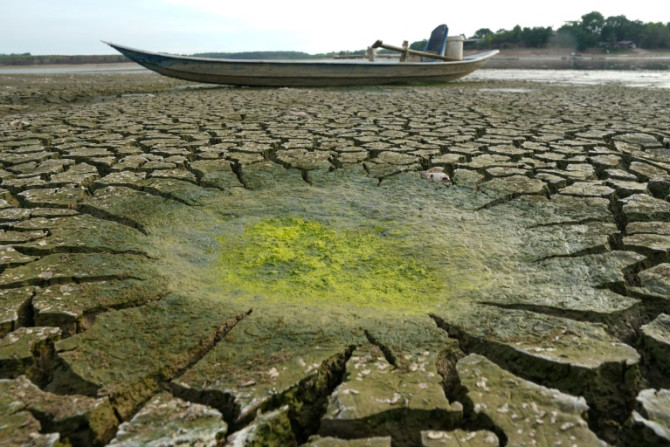 A boat sits on a dried-up reservoir bed in southern Vietnam's Dong Nai province last month