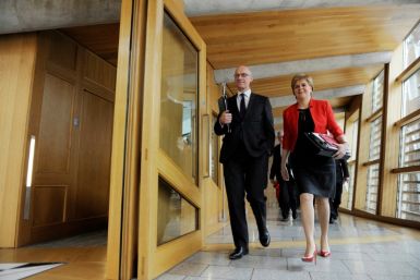 John Swinney (L) is seen as among the SNP old guard and close to former first minister Nicola Sturgeon (R)