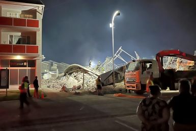 The five-storey building was flattened in the collapse trapping a construction crew